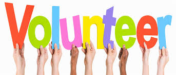 Image of hands holding volunteer sign 