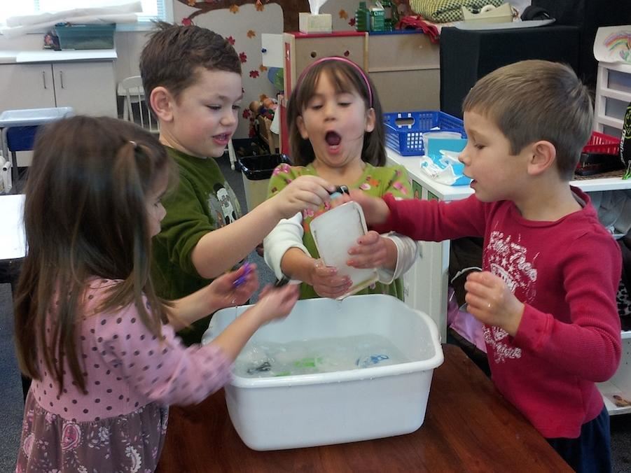 TK students washing dishes 