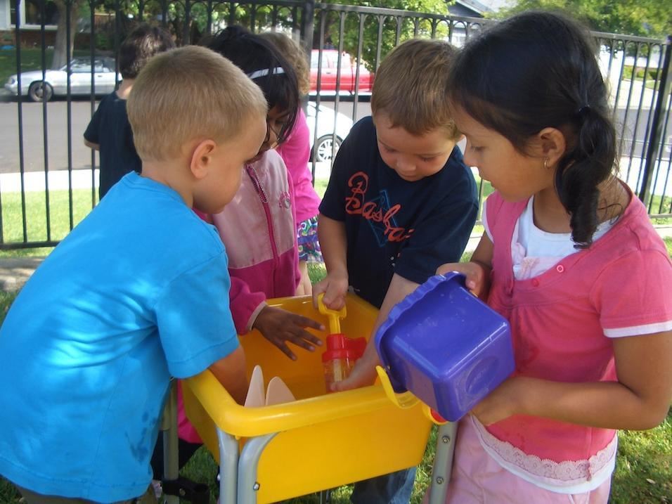 TK students playing with sand toys 